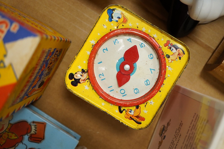 A group of thirteen novelty money boxes, including a Noddy book money box, a Snoopy money box and a Micky Mouse money box. Condition - varies